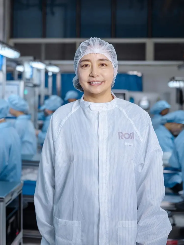 A female manager in the assembly hall at Rosti China