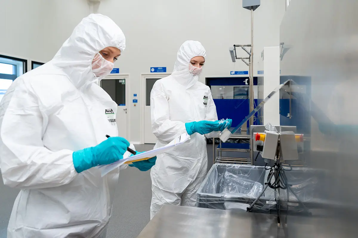 Two staff covered and working in Cleanroom 8