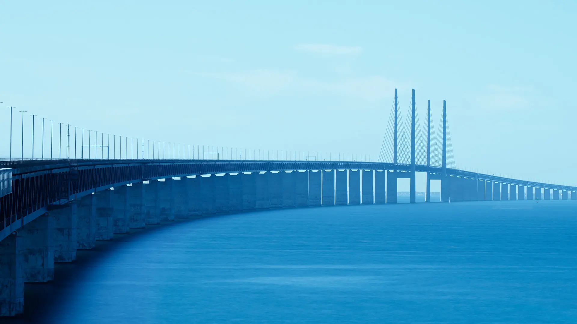 Blue sky and blue water with a beutiful bridge.