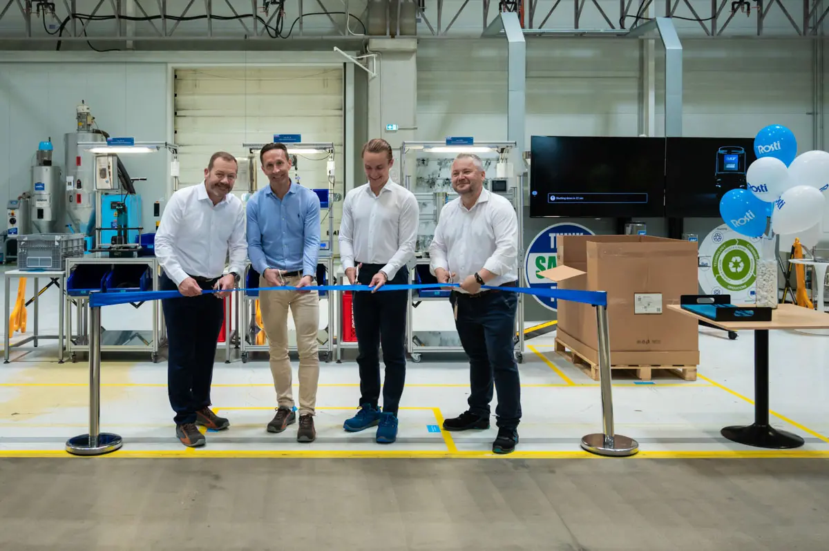 Representants from Rosti and from SKF cutting a ribbon to mark the start of Contract manufacturing production.