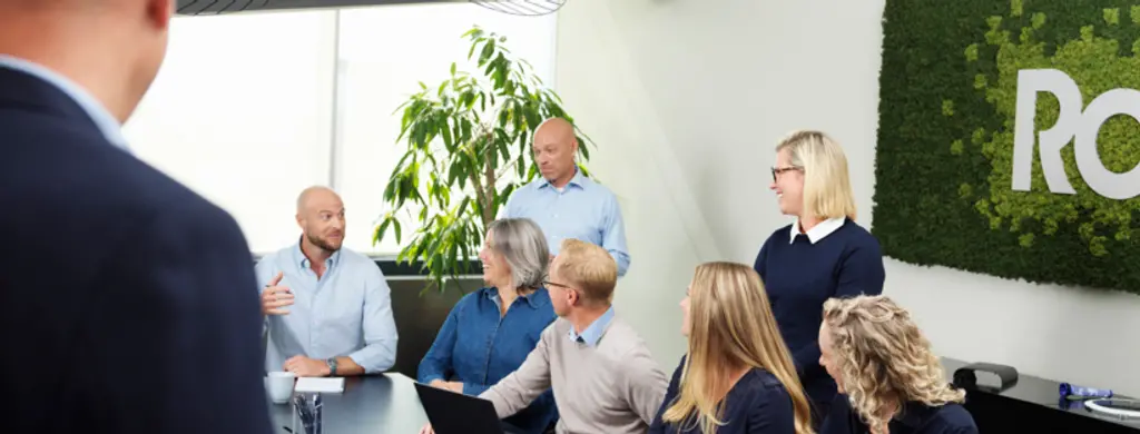 Rosti colleagues in a meeting