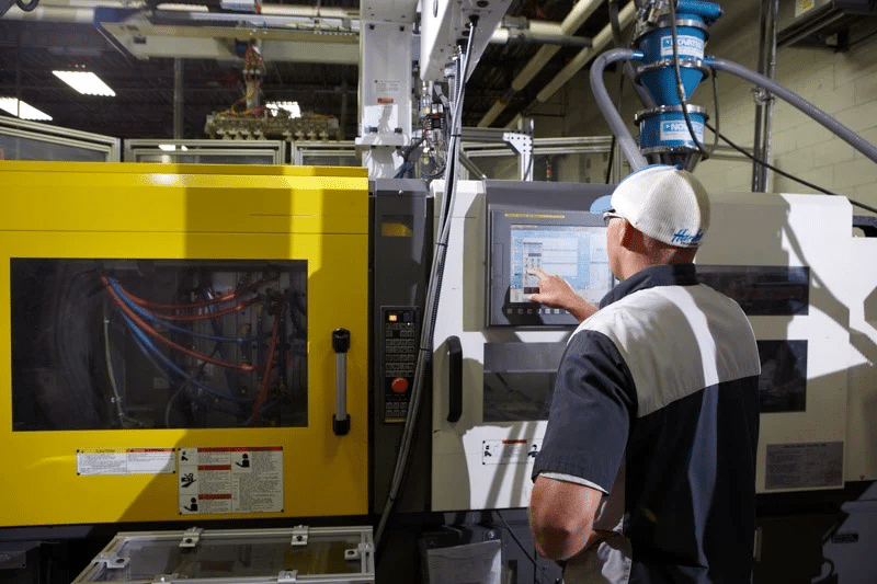 Plastic Components Inc. representative using scientific molding practices while producing high volume plastic parts.