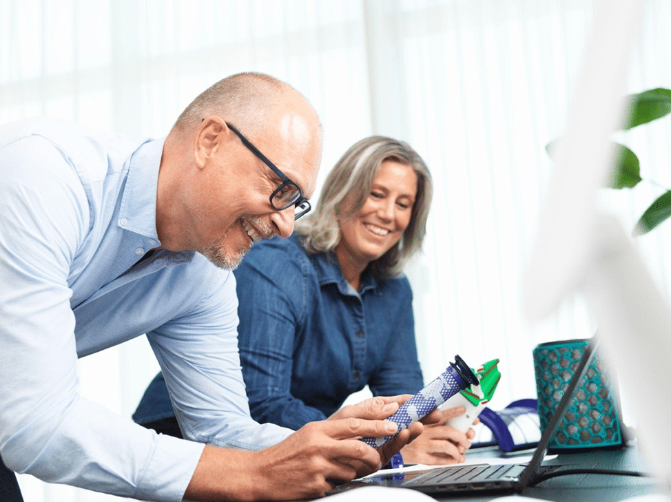 two people working looking at a product for filtration