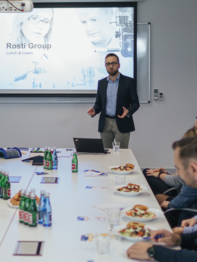 people eating lunch and learning about Rostis Plastic Injection Moulding.