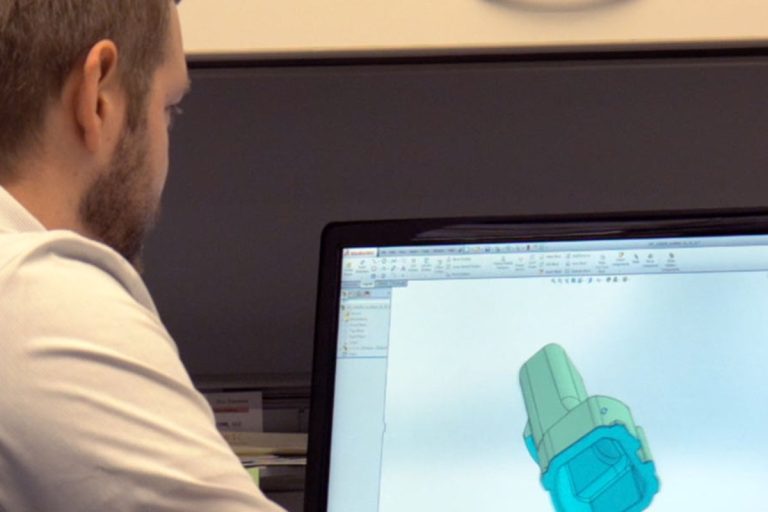 Man with computor, Simulations is a part of the precision process