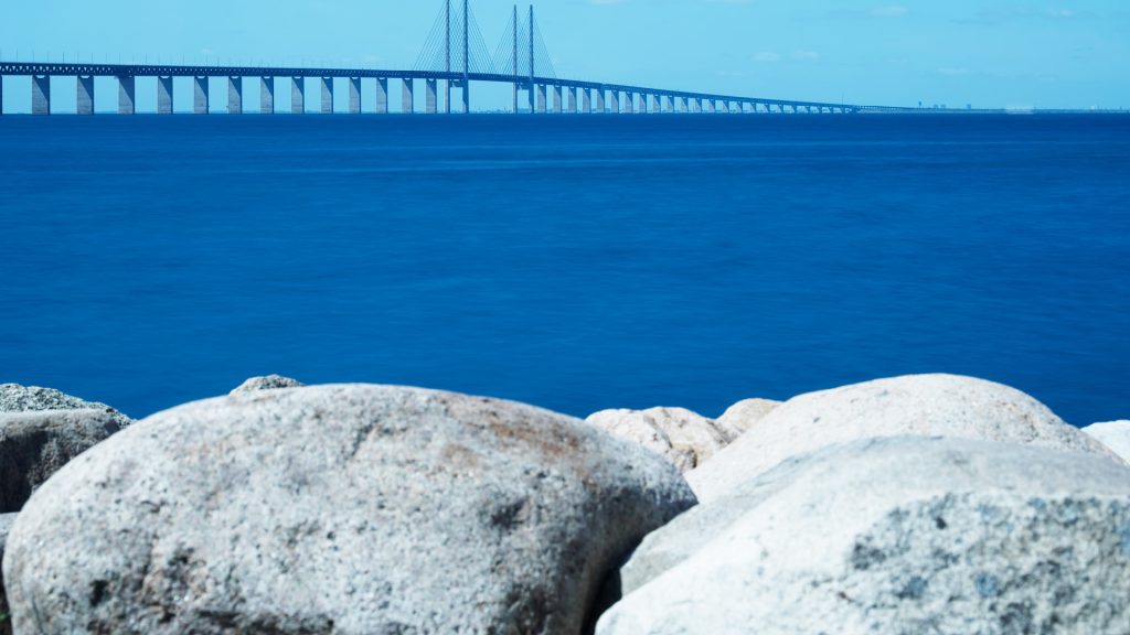 Blue sea, brige heavy stones